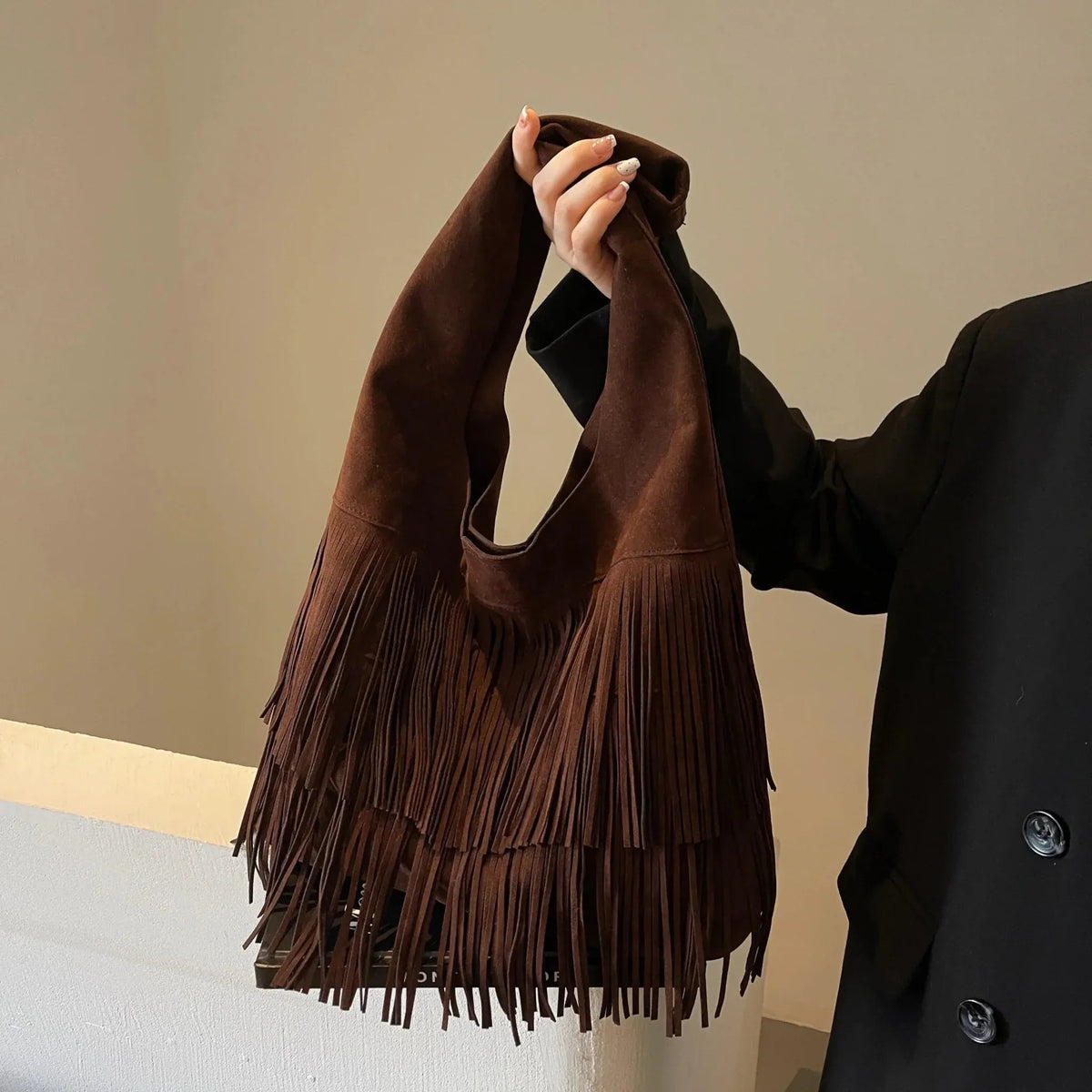 Faux suede fringe shoulder tote bag, product still life
