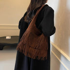 Faux suede fringe shoulder tote bag, product still life