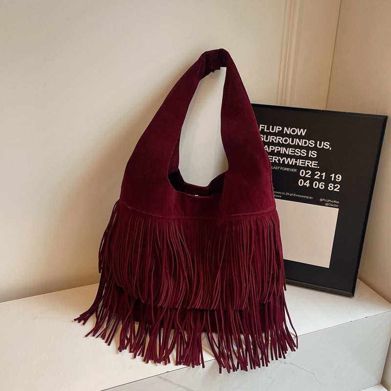 Faux suede fringe shoulder tote bag, product still life