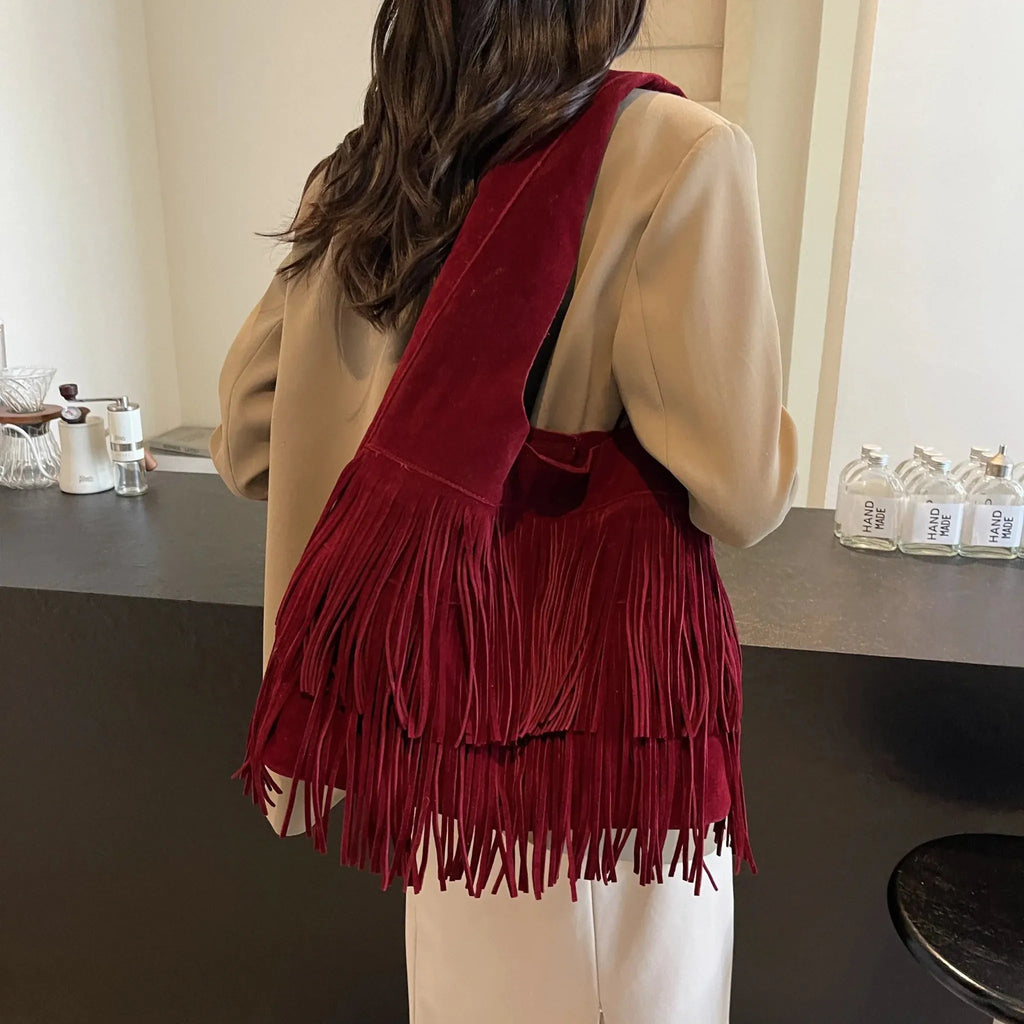 Faux suede fringe shoulder tote bag, product still life