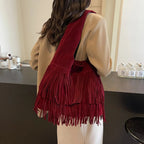 Faux suede fringe shoulder tote bag, product still life