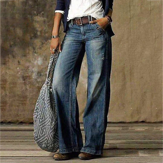 Women's blue baggy wide leg jeans with a retro faded denim wash