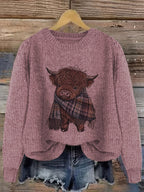 Close-up of highland cow print on crewneck jumper