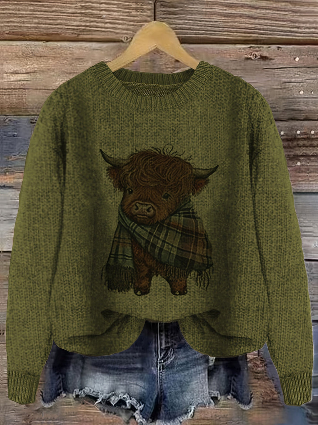 Highland cow print jumper laid flat