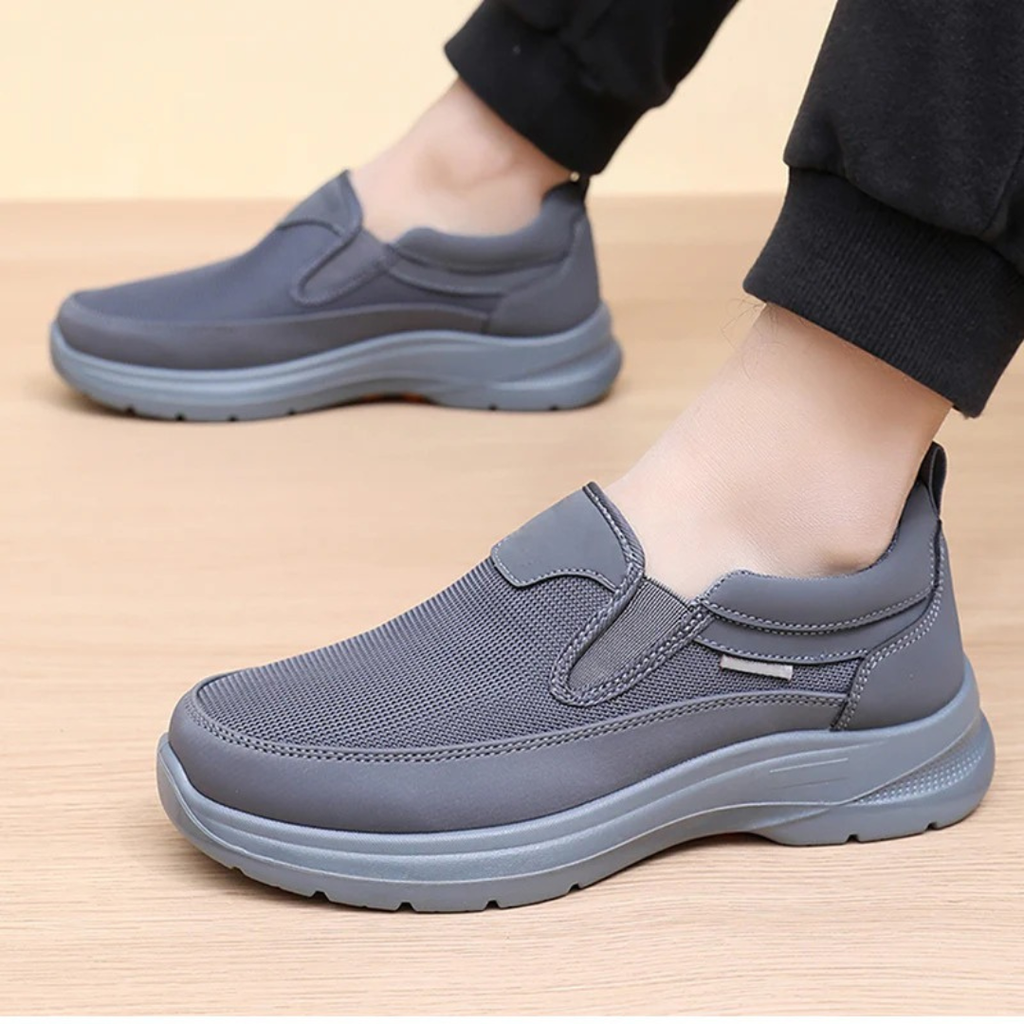 Men's slip-on comfort trainers, product still life