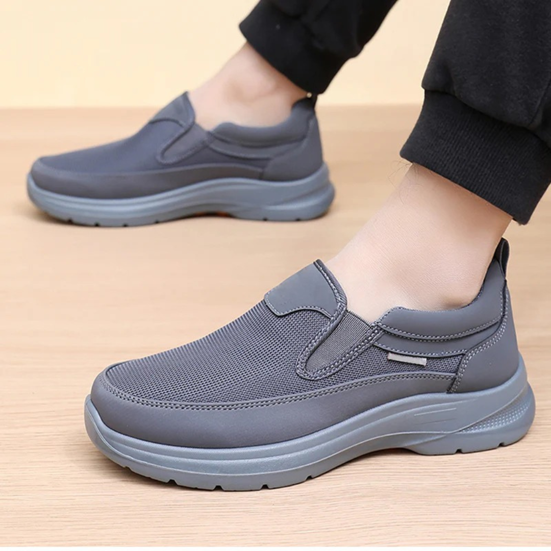 Men's slip-on comfort trainers, product still life