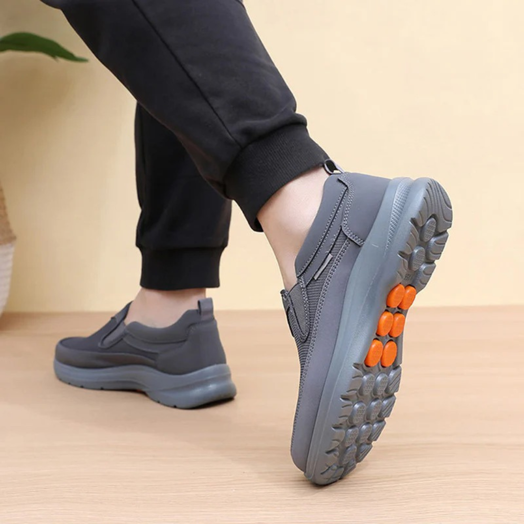 Men's slip-on comfort trainers, product still life