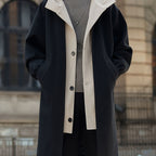 Close-up of button fastening on oversized longline coat