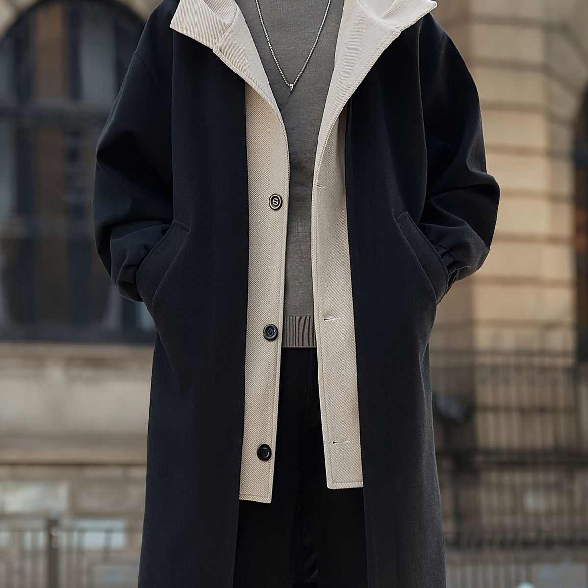 Close-up of button fastening on oversized longline coat