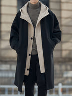 Oversized hooded longline coat laid flat