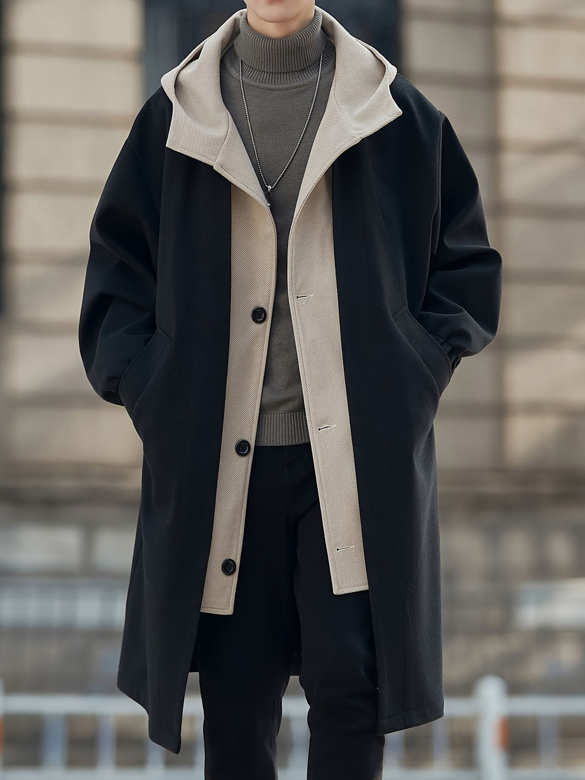 Oversized hooded longline coat laid flat