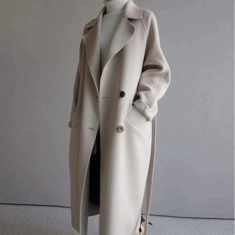 Women's beige longline wool blend coat with a tailored, elegant fit