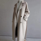 Women's beige longline wool blend coat with a tailored, elegant fit