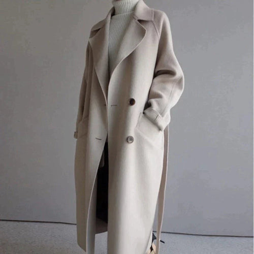 Women's beige longline wool blend coat with a tailored, elegant fit