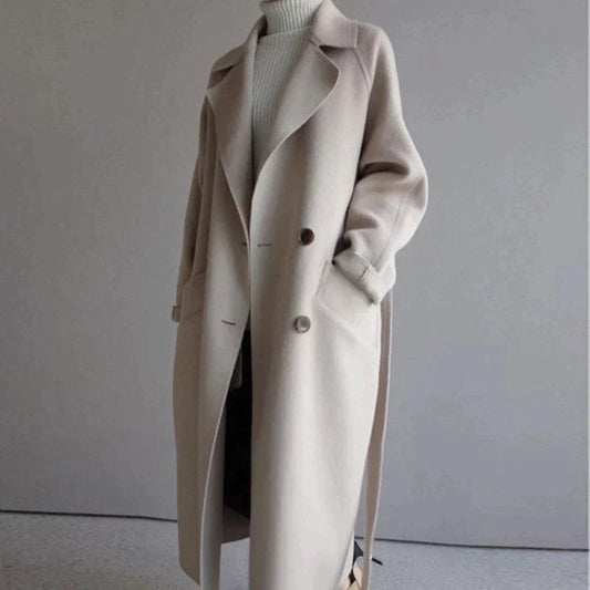 Women's beige longline wool blend coat with a tailored, elegant fit