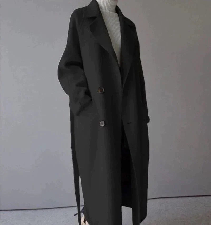 Women's beige longline wool blend coat with a tailored, elegant fit