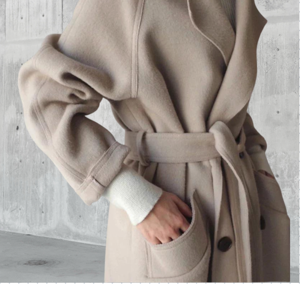 Women's beige longline wool blend coat with a tailored, elegant fit