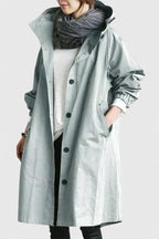 Women's light grey oversized parka with an adjustable hood