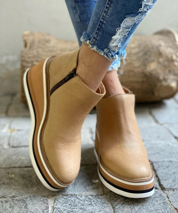 Waterproof wide fit boots with textured sole, product still life