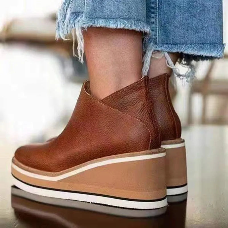 Waterproof wide fit boots with textured sole, product still life
