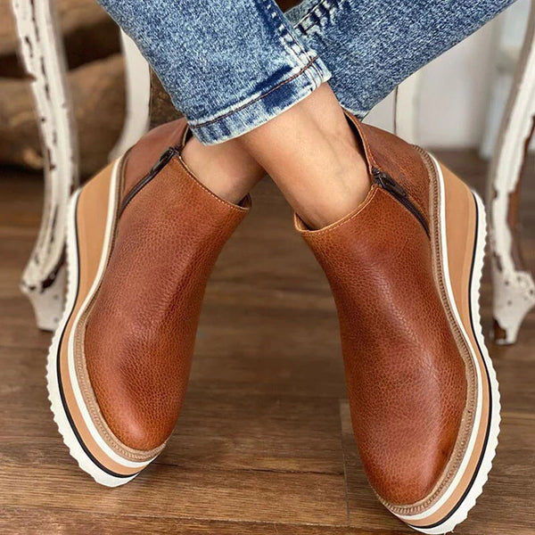 Waterproof wide fit boots with textured sole, product still life