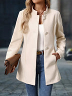 Stand-collar button-front coat, product still life
