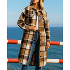 Checked longline coat, product still life