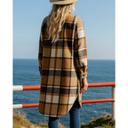 Checked longline coat, product still life