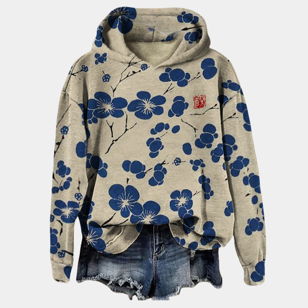 Blue botanical print hoodie with a relaxed fit and drawstring hood