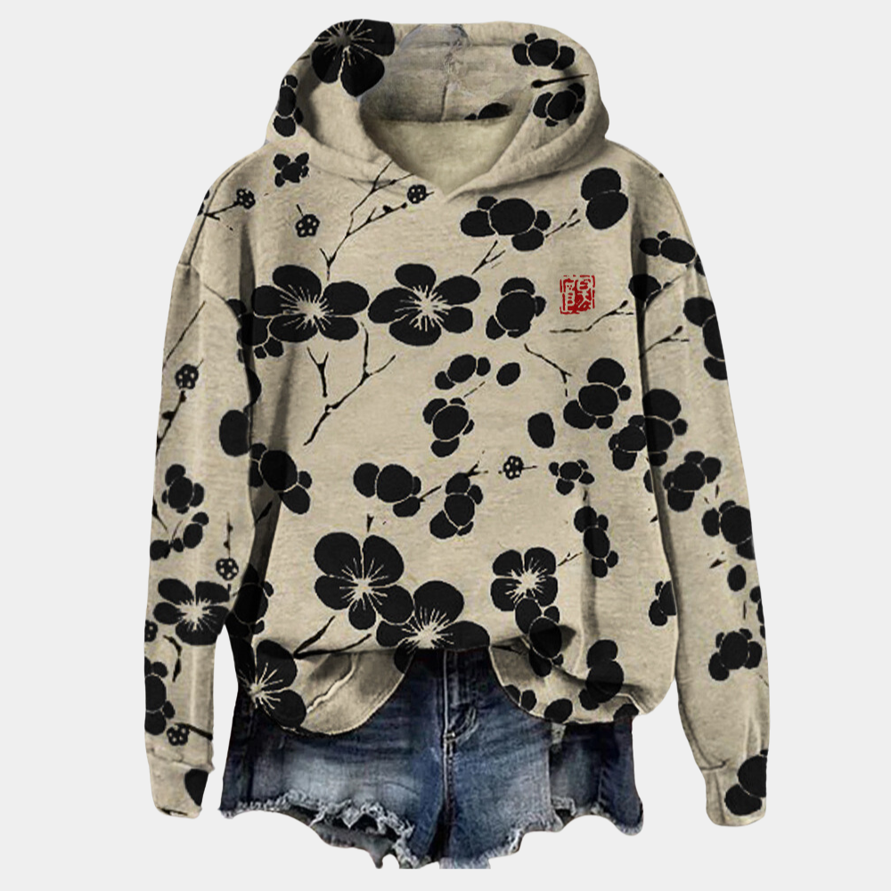 Blue botanical print hoodie with a relaxed fit and drawstring hood