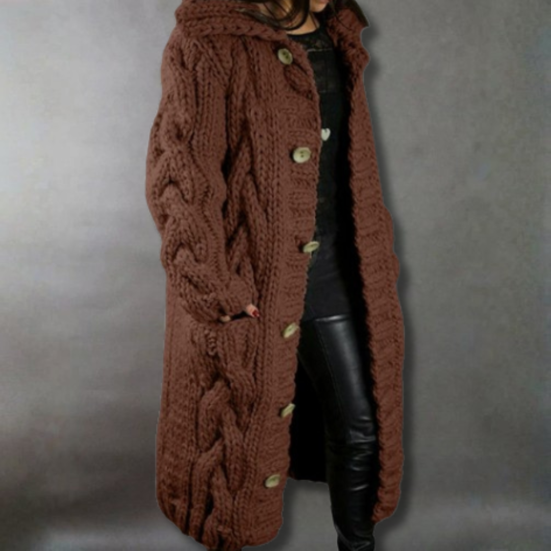 Women's pink oversized cable knit longline coat with a chunky texture