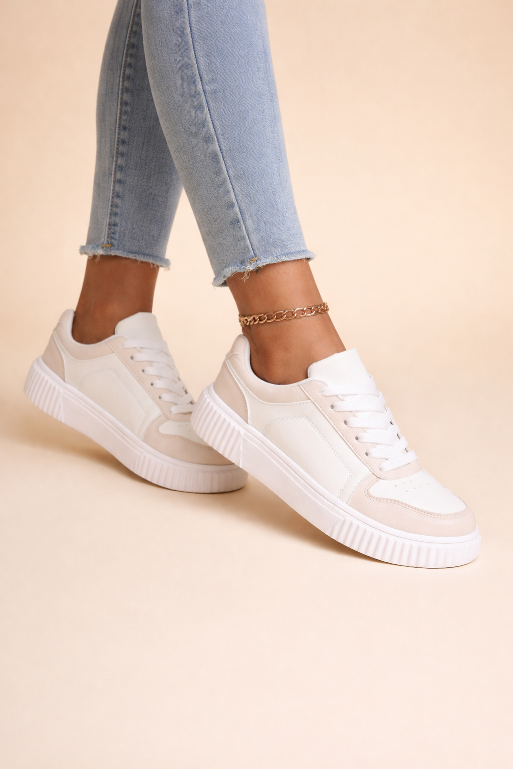 Women's beige non-slip chunky trainers with a cushioned interior