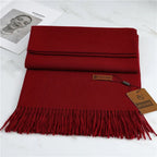 Women's burgundy cashmere scarf with soft tassel trim for autumn styling