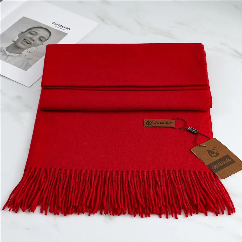 Women's red cashmere scarf with soft tassel trim for autumn styling