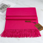 Women's bright pink cashmere scarf with soft tassel trim for autumn styling
