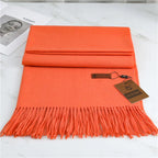 Women's orange cashmere scarf with soft tassel trim for autumn styling