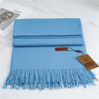 Women's blue cashmere scarf with soft tassel trim for autumn styling