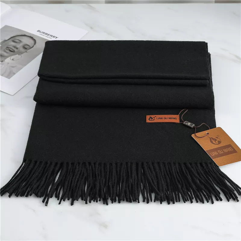Women's black cashmere scarf with soft tassel trim for autumn styling