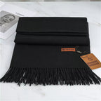 Women's black cashmere scarf with soft tassel trim for autumn styling