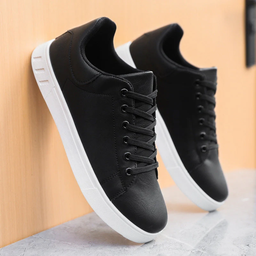 Close-up of stitching detail on men's leather trainers