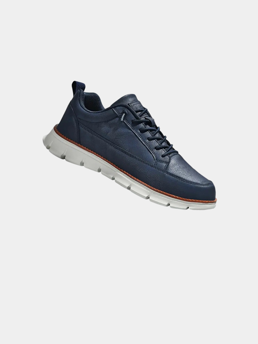 Leather trainers with supportive sole, product still life