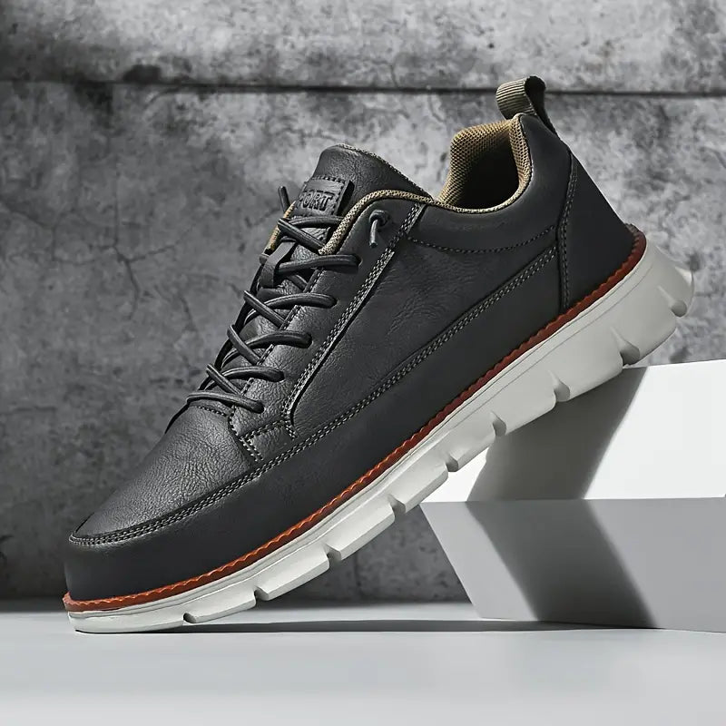 Leather trainers with supportive sole, product still life