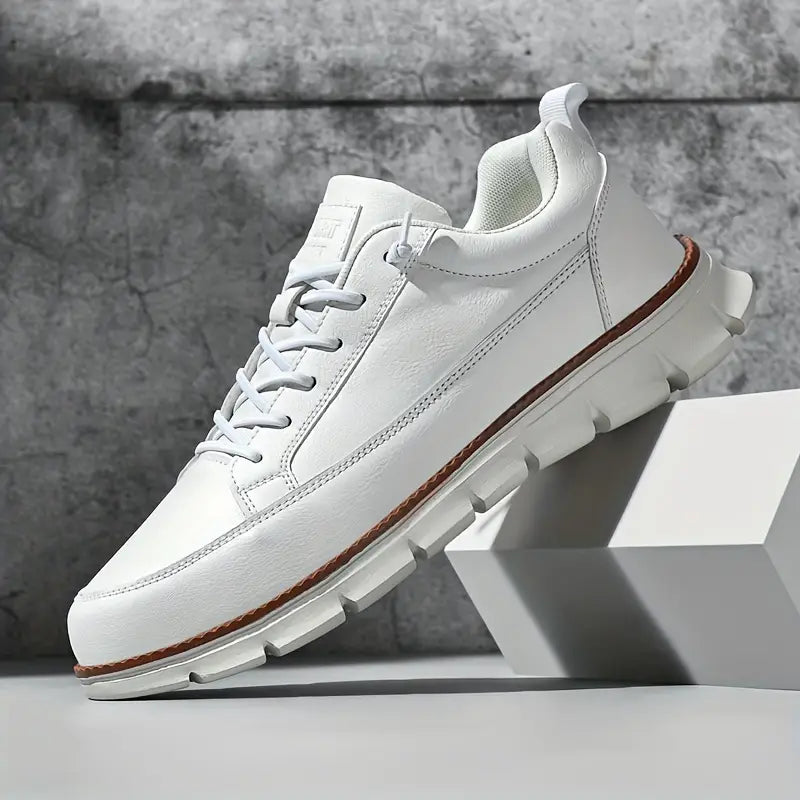 Leather trainers with supportive sole, product still life