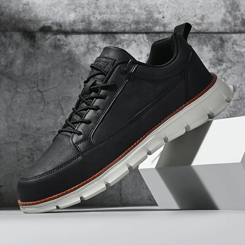 Leather trainers with supportive sole, product still life
