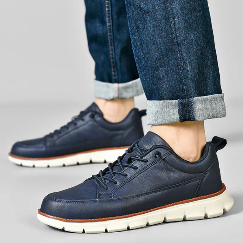 Leather trainers with supportive sole, product still life