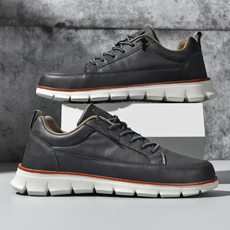 Leather trainers with supportive sole, product still life