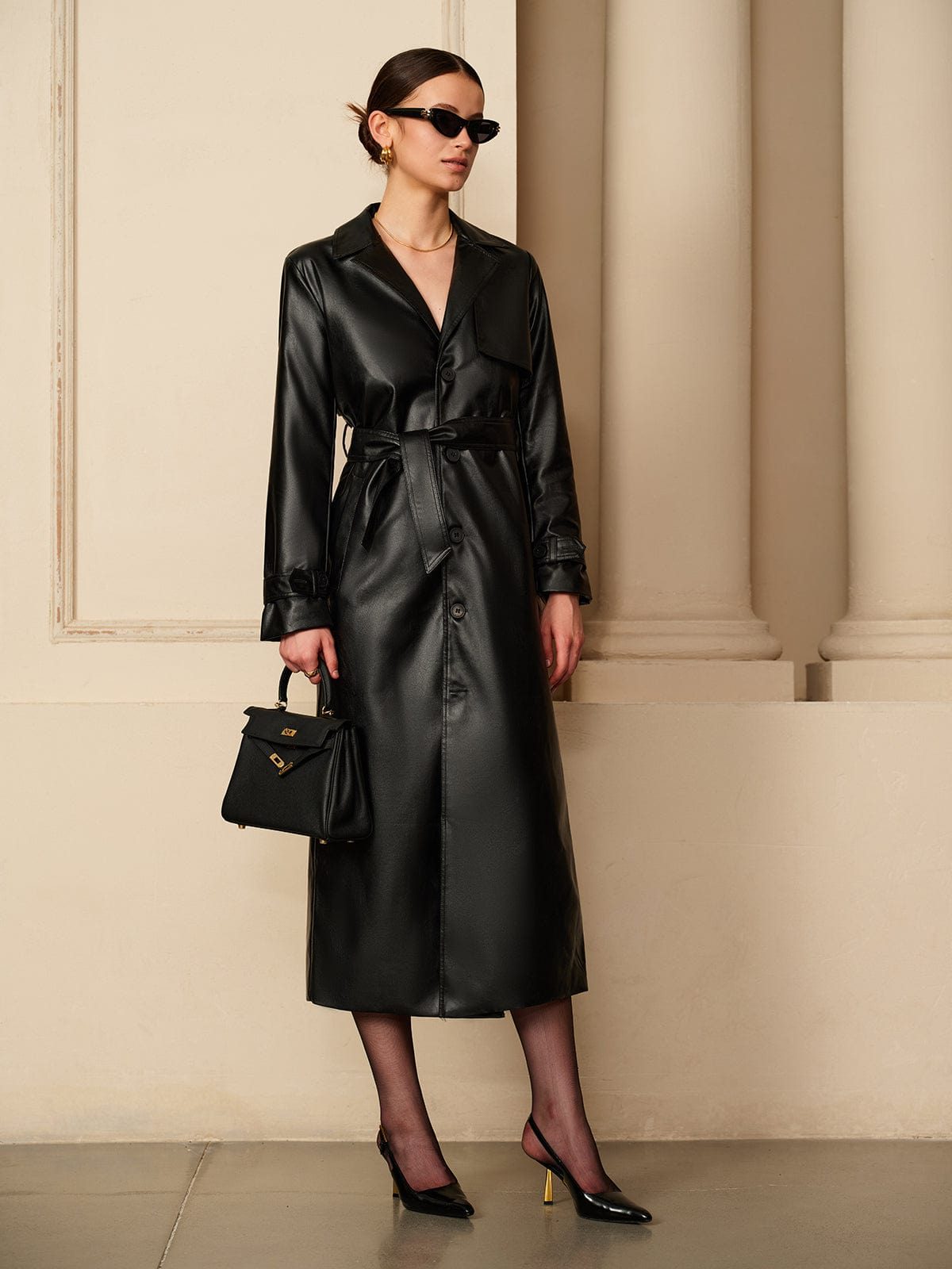 Black faux leather trench coat, front view