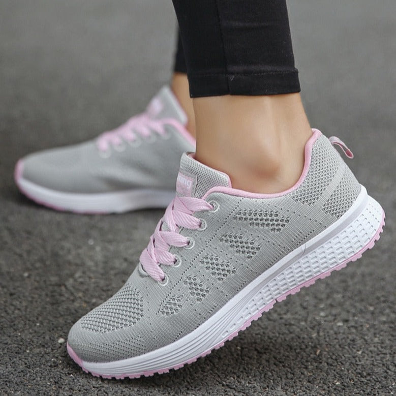 Women's grey and pink lightweight mesh walking trainers with a lace up closure
