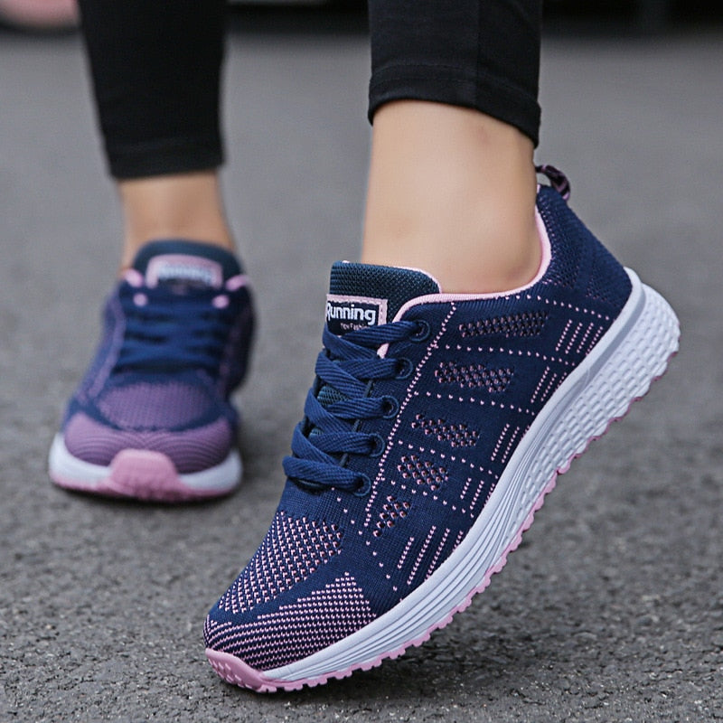 Women's navy and pink lightweight mesh walking trainers with a lace up closure
