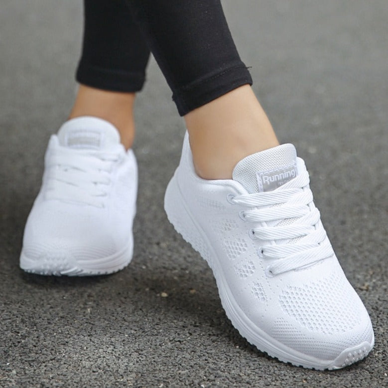 Women's lightweight mesh walking trainers with a lace up closure, front view